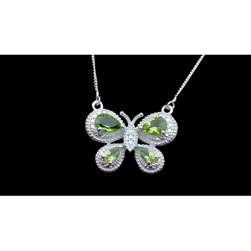 383 - A SILVER PERIDOT BUTTERFLY NECKLACE