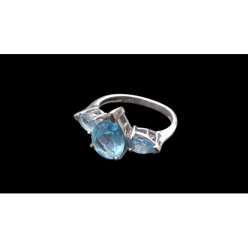 420 - A SILVER SET RING WITH AQUAMARINE STYLE STONES