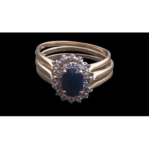 449 - 9ct GOLD SAPPHIRE AND DIAMOND RING WITH FITTINGS RINGS TO EACH SIDE 7 DIAMONDS TO EACH OVAL SETTING ... 