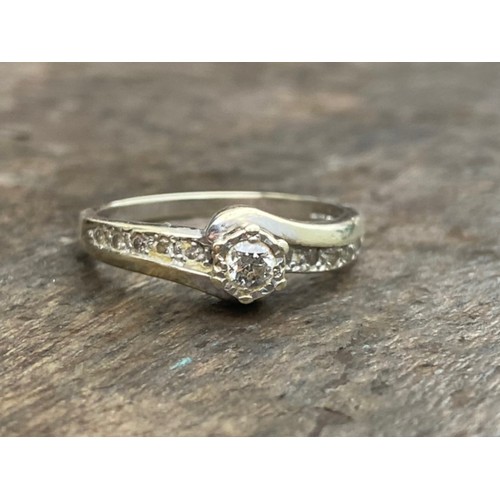 457 - A 9CT GOLD DIAMOND SOLITAIRE RING WITH DIAMONDS TO SHOULDER