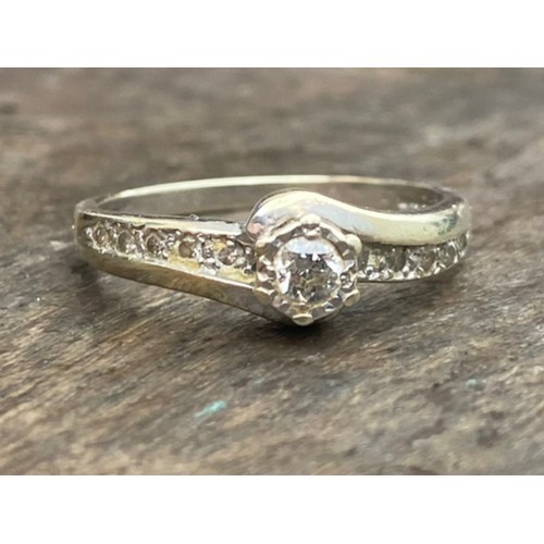 457 - A 9CT GOLD DIAMOND SOLITAIRE RING WITH DIAMONDS TO SHOULDER