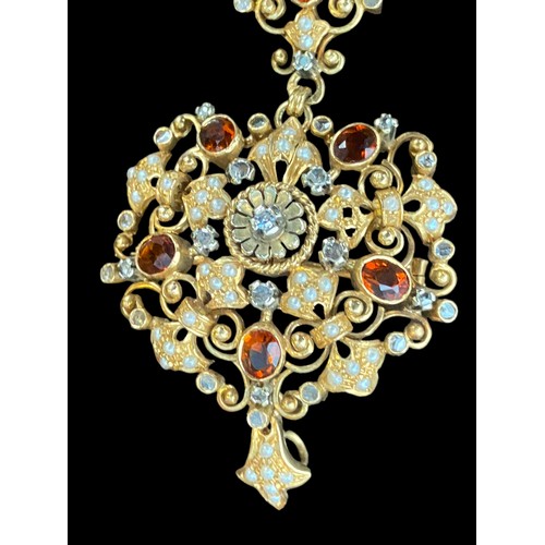 462 - A BROOCH/ PENDANT  ANTIQUE ,VERY DETAILED SET WITH DIAMONDS ,SEED PEARLS (2 MISSING) AND BROWN STONE... 