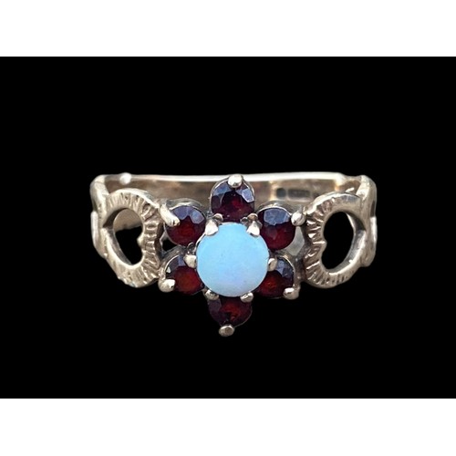 476 - STUNNING 9ct GOLD GARNET AND OPAL RING WITH HEARTS TO BAND