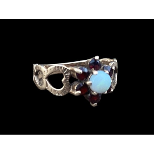 476 - STUNNING 9ct GOLD GARNET AND OPAL RING WITH HEARTS TO BAND