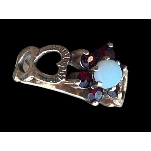 476 - STUNNING 9ct GOLD GARNET AND OPAL RING WITH HEARTS TO BAND