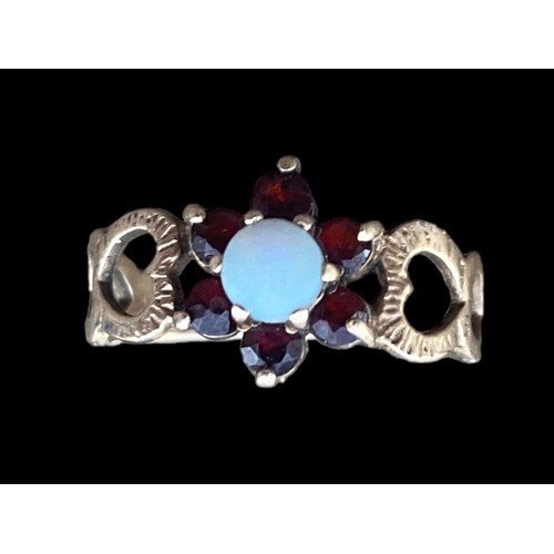 476 - STUNNING 9ct GOLD GARNET AND OPAL RING WITH HEARTS TO BAND