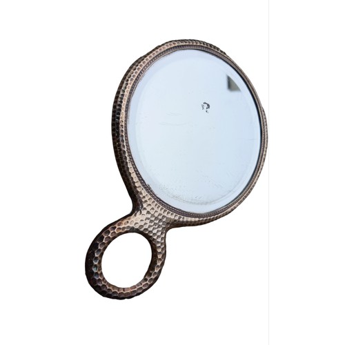 481 - A SILVER MIRROR WITH DIMPLE PATTERN