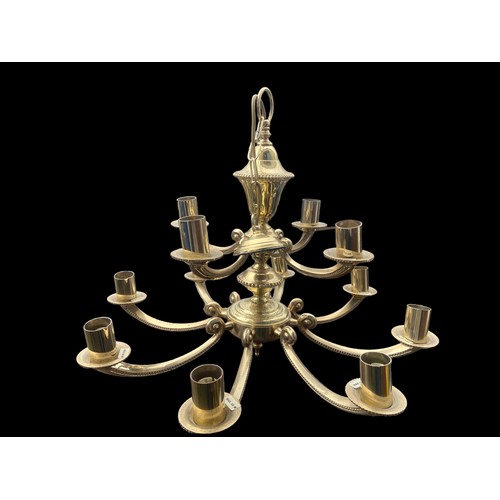 500 - AN ORNATE HEAVY BRASS 12 BRANCH CHANDILIER