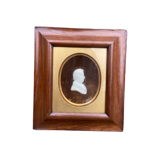 516 - A SIGNED WALNUT FRAMED BUST OF A GENT 11.5X10