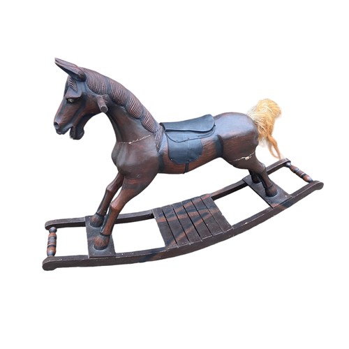 511 - A VINTAGE WOODEN ROCKING HORSE (HAS REPAIRS)