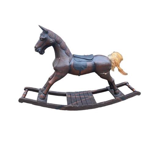 511 - A VINTAGE WOODEN ROCKING HORSE (HAS REPAIRS)