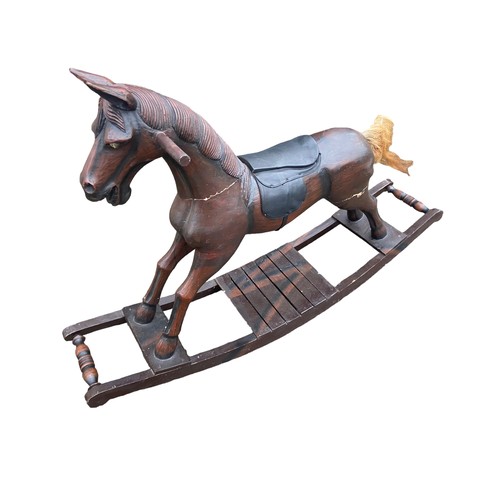 511 - A VINTAGE WOODEN ROCKING HORSE (HAS REPAIRS)