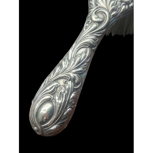 480 - A BEAUTIFULLY EMBOSSED SILVER BRUSH