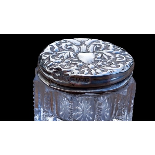 583 - A SMALL CUT GLASS JAR WITH A CHESTER SILVER LID