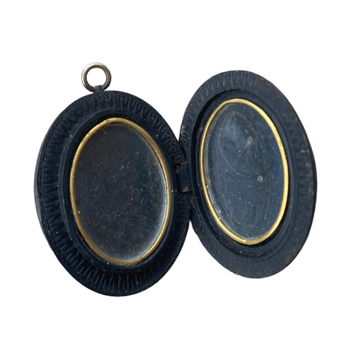 570 - A VICTORIAN BOG OAK CAMEO LOCKET