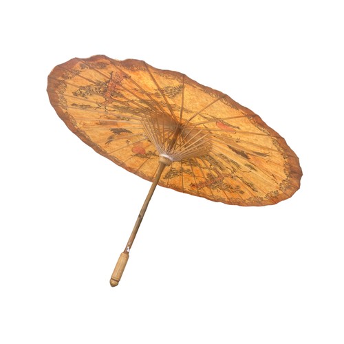 140 - AN ORIENTAL UMBRELLA