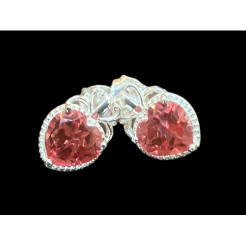 194 - A PAIR OF ORNATE SILVER EARRINGS SET WITH PINK HEART SHAPED STONES