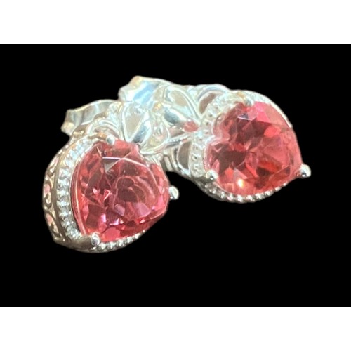 194 - A PAIR OF ORNATE SILVER EARRINGS SET WITH PINK HEART SHAPED STONES