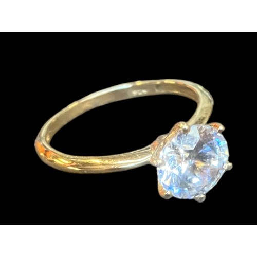 221 - A SILVER GILT LARGE SOLITAIRE RING