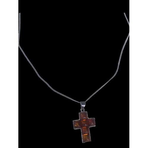 416 - A SILVER & AMBER SET CROSS ON A SILVER CHAIN