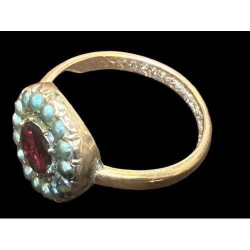 563 - AN ANTIQUE ROSE GOLD SEED PEARL & RUBY RING