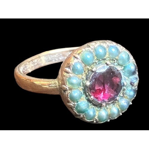 563 - AN ANTIQUE ROSE GOLD SEED PEARL & RUBY RING