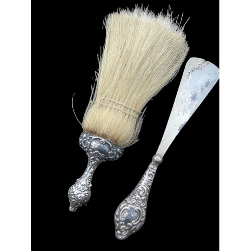 568 - A CHESTER SILVER HANDLED SHOE HORN AND ANOTHER SILVER HANDLED BRUSH