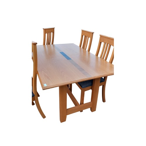 584 - A QUALITY SOLID OAK DINING TABLE COMPLETE WITH AN EXTRA LEAF & 6 MATCHING CHAIRS