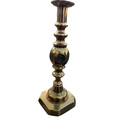 612 - A PAIR OF HEAVY BULLS EYE BRASS CANDLESTICKS 12