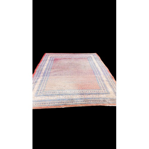 657 - A VERY LARGE HAND MADE IRIAN RUG SOME FADING