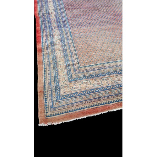 657 - A VERY LARGE HAND MADE IRIAN RUG SOME FADING