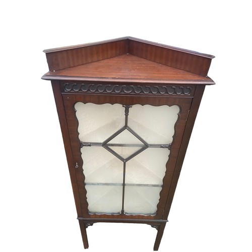 84 - AN ANTIQUE MAHOGANY ASTRO GLAZED CORNER DISPLAY CABINET