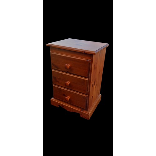 30 - A PINE 3 DRAWERED BEDSIDE