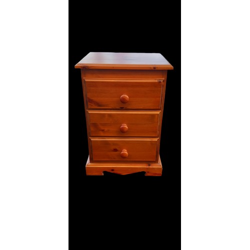 30 - A PINE 3 DRAWERED BEDSIDE