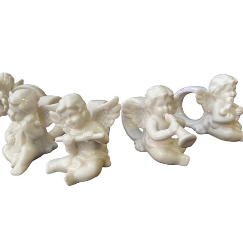 129 - 6 MUSICAL CHERUB NAPKIN RINGS