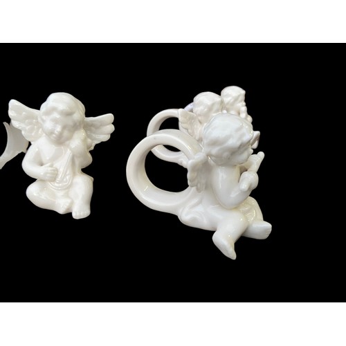 129 - 6 MUSICAL CHERUB NAPKIN RINGS