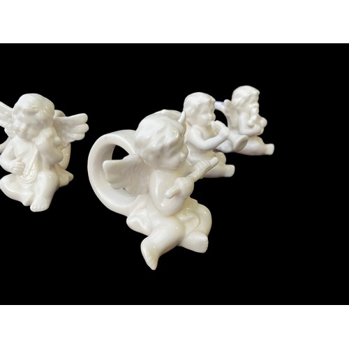 129 - 6 MUSICAL CHERUB NAPKIN RINGS