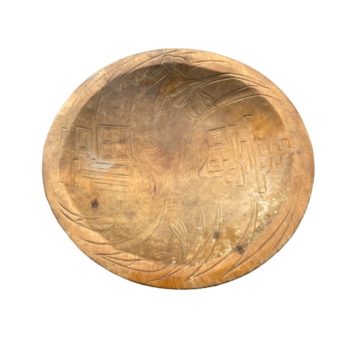 63 - AN ANTIQUE CARVED PINE PLATE 11