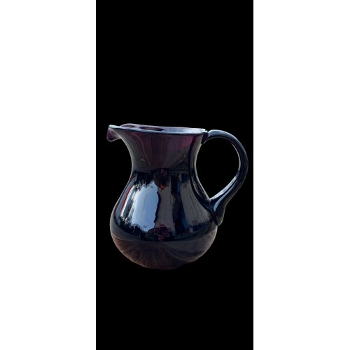 127 - A LAVENDER  GLASS JUG 8.5