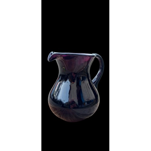 127 - A LAVENDER  GLASS JUG 8.5