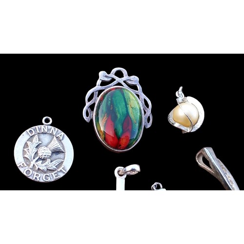 236 - 7 SILVER PENDANTS