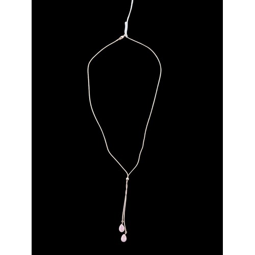 238 - A ROSE GOLD COLOURED NECKLACE WITH ROSE QUARTZ STONES