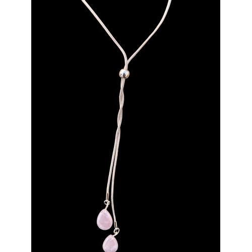 238 - A ROSE GOLD COLOURED NECKLACE WITH ROSE QUARTZ STONES
