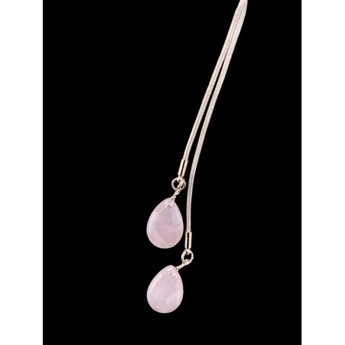 238 - A ROSE GOLD COLOURED NECKLACE WITH ROSE QUARTZ STONES