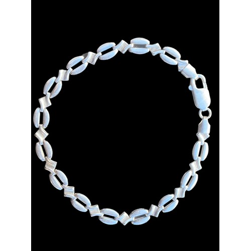 251 - A FANCY SILVER FLAT LINK BRACELET