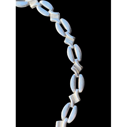 251 - A FANCY SILVER FLAT LINK BRACELET