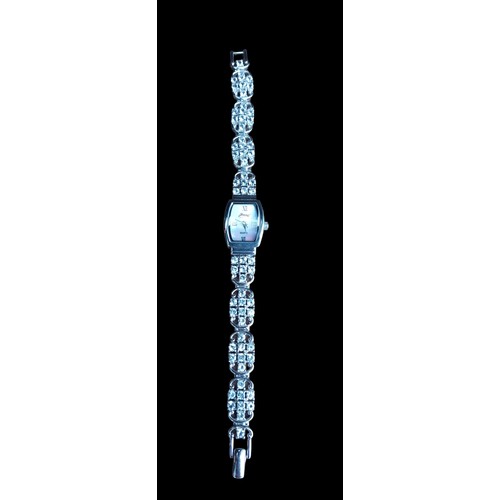 255 - A SILVER WATCH WITH RECTANGULAR M.O.P DIAL ON WHITE STONE BRACELET GEMS MADE
