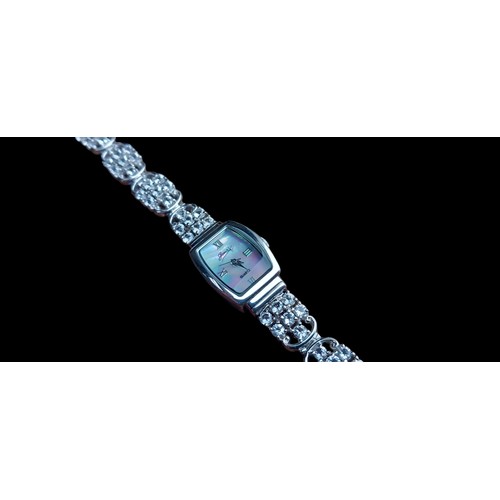 255 - A SILVER WATCH WITH RECTANGULAR M.O.P DIAL ON WHITE STONE BRACELET GEMS MADE