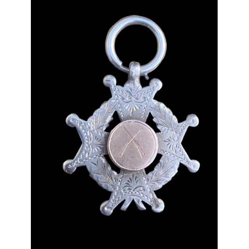 279 - AN EDWARDIAN GOLD AND SILVER MEDAL WITH CROSSED RIFLES WON BY JOHN KIRK BELFAST 1903 A.G.L