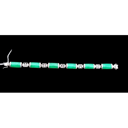 280 - A SILVER JADE BRACELET 7.5
